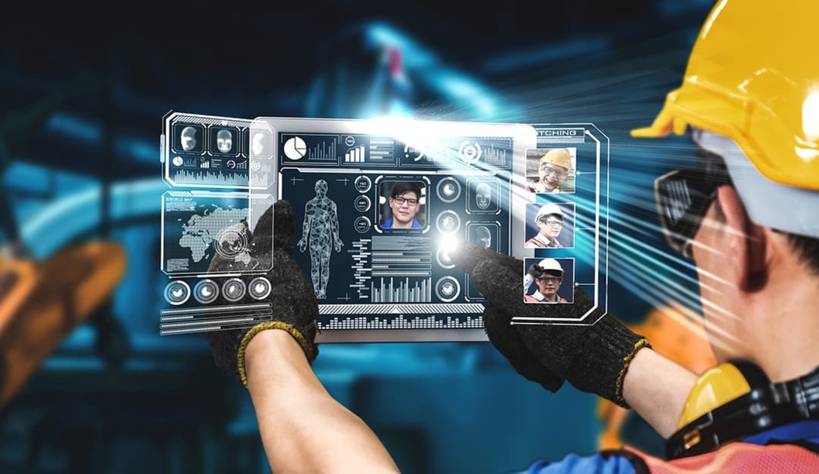 man in hard hat using tablet to communicate with others